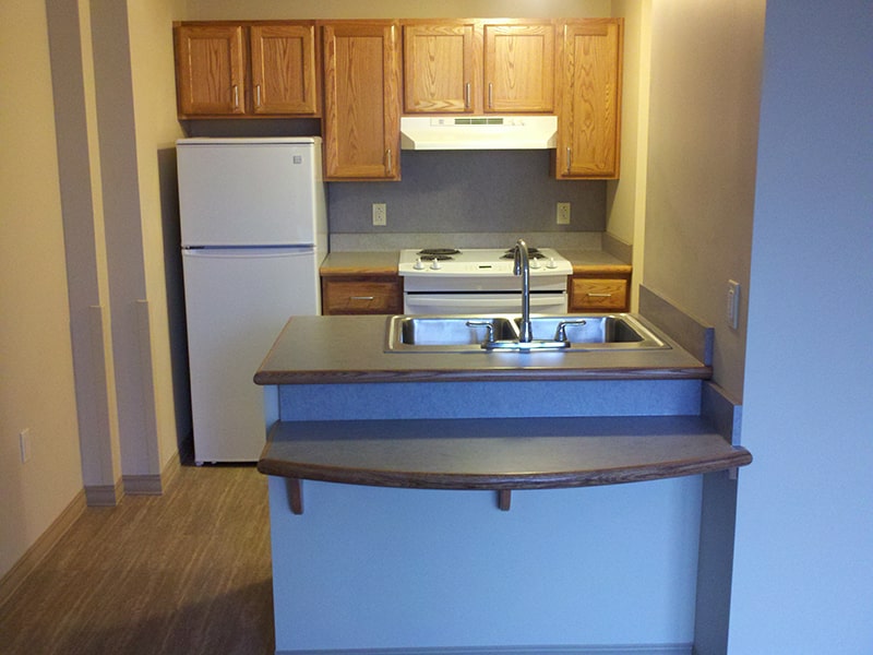 Margaret Wagner Apartments kitchen with counter-top seating