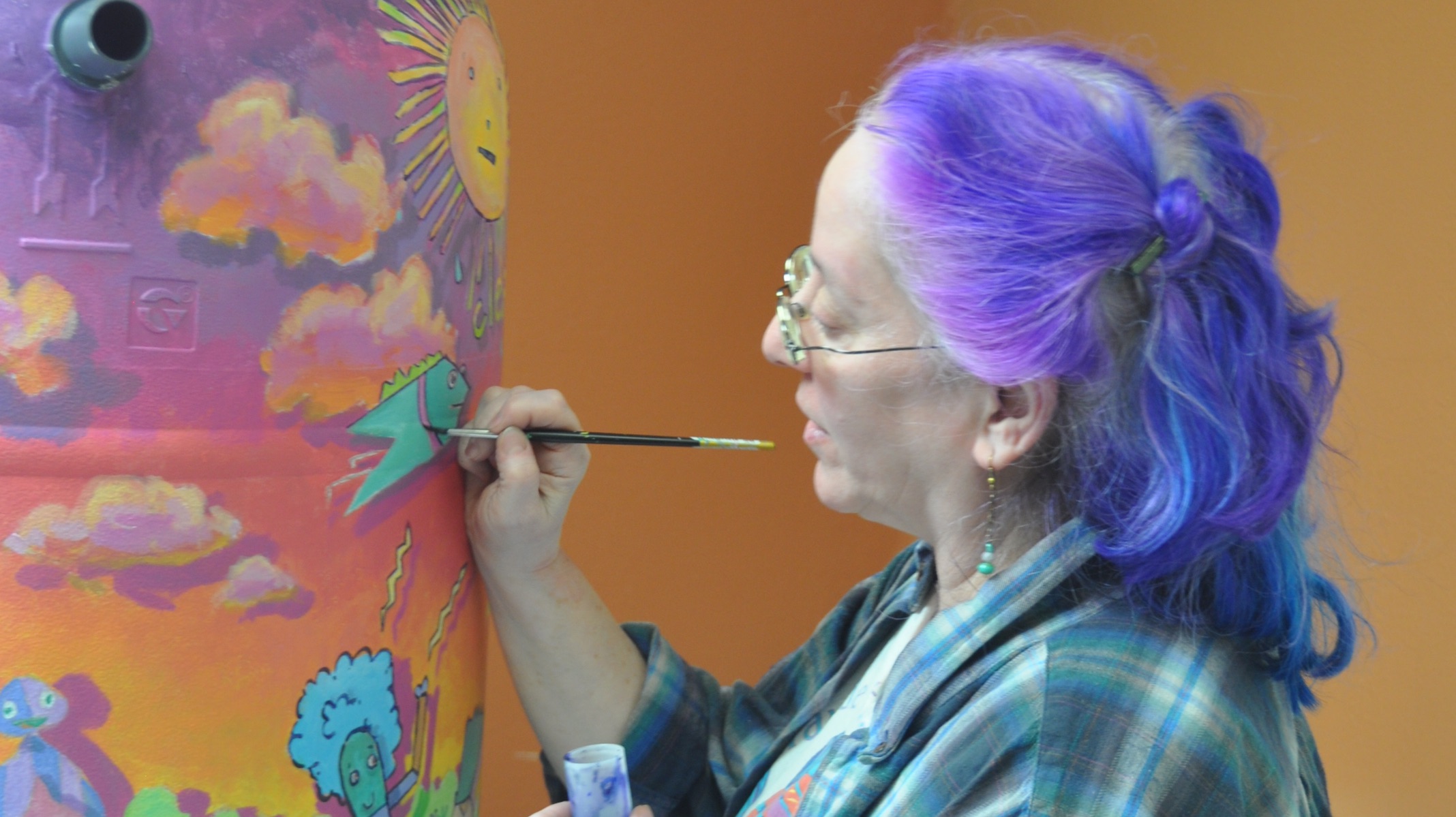 An older adult creating colorful artwork