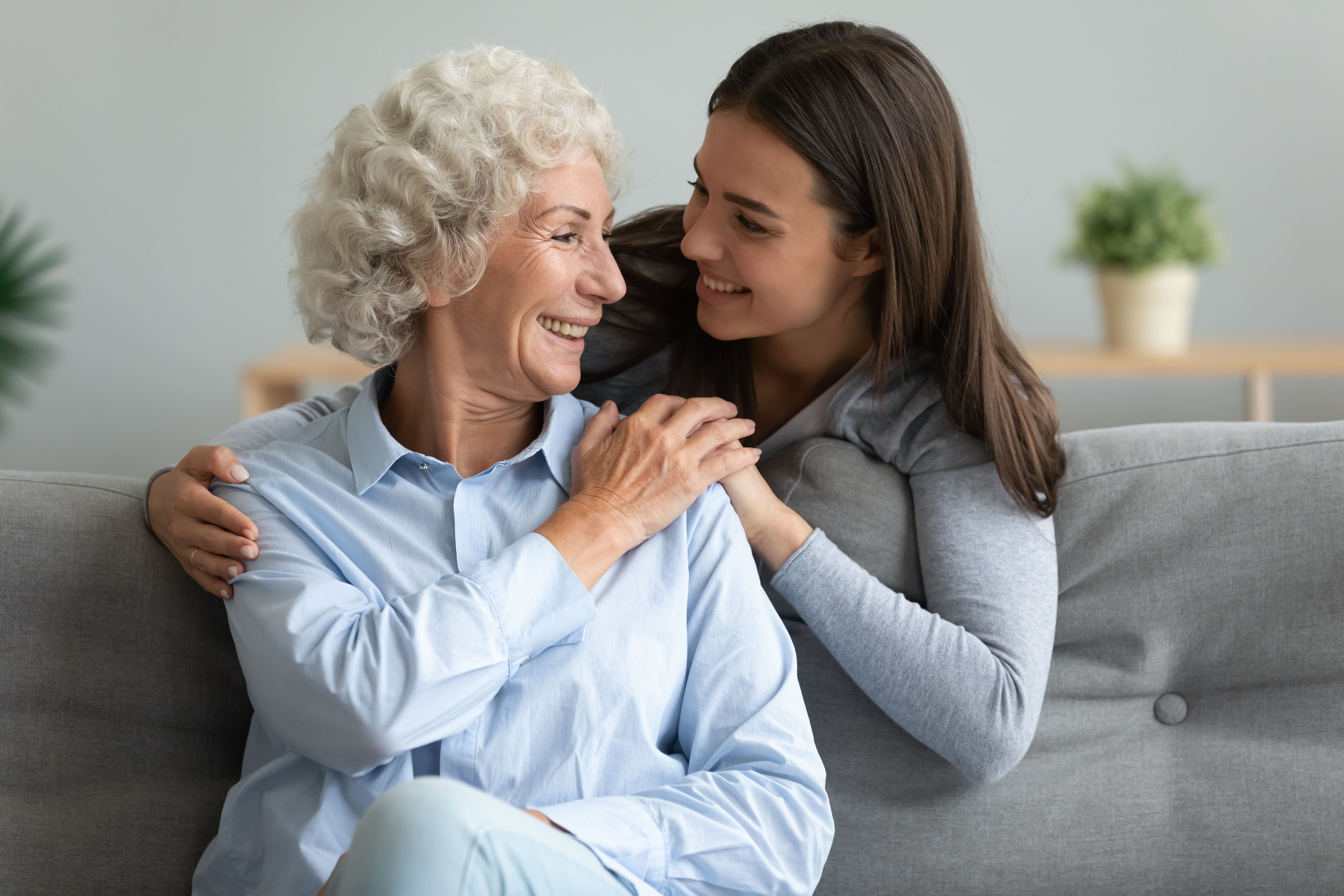 A caregiver bolstering her older loved one