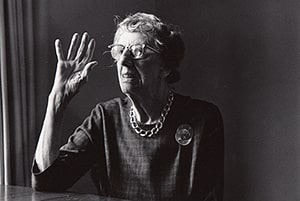 Margaret Wagner, the first executive director of Benjamin Rose, sitting and waving