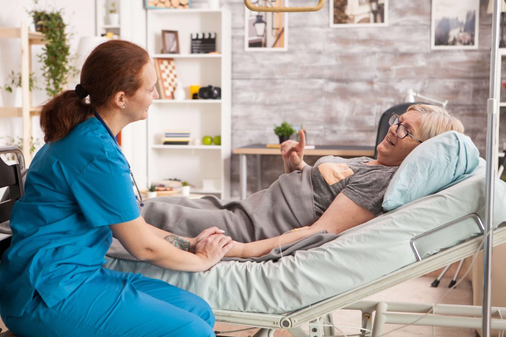 A nurse taking care of a home hospice patient